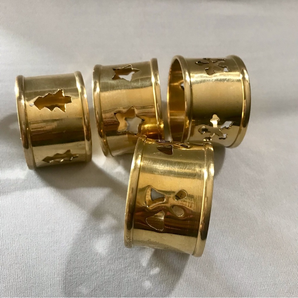 Set of 4 brass Christmas napkin holders.